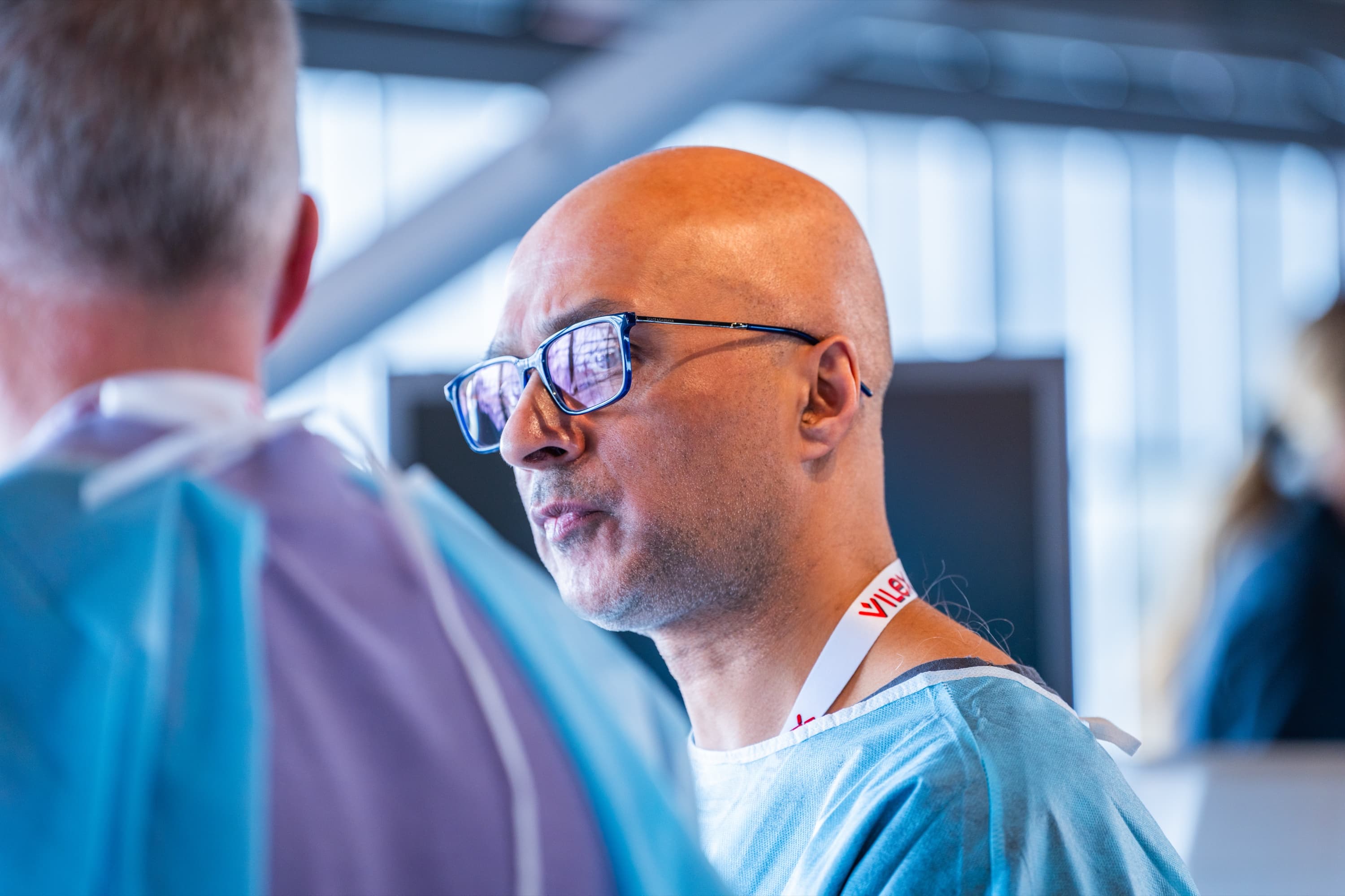 A participant in scrubs looks on during Hintermann 2025.